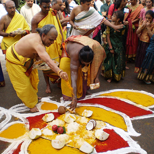 Priests Perform a Ritual around the Rangoli Pattern