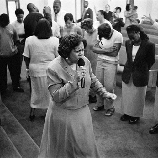 Pastor Praying for Congregation