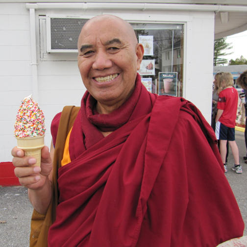 Buddhism monk eating ice cream with sprinkles